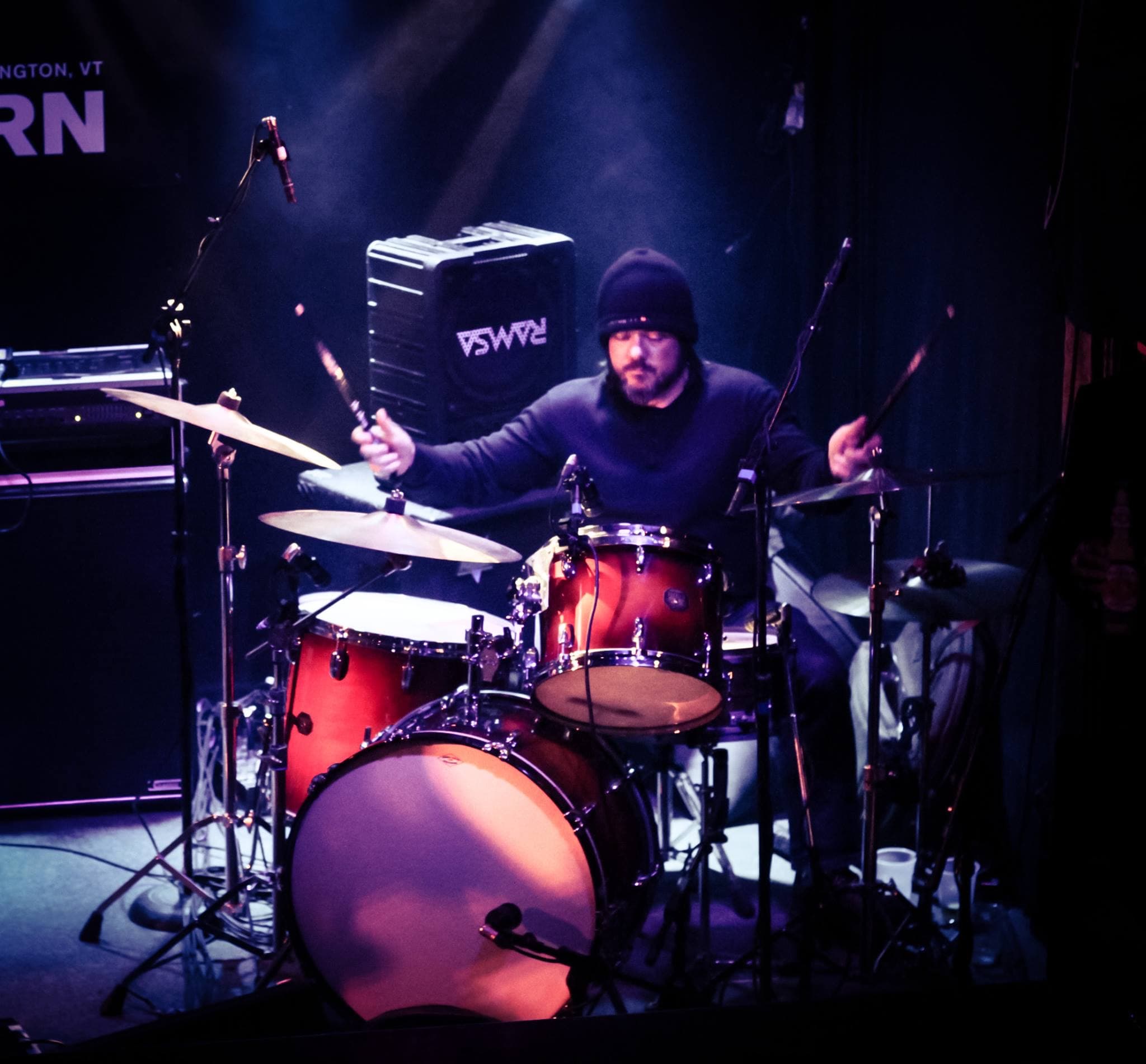 Knit hat playing red drumkit live music